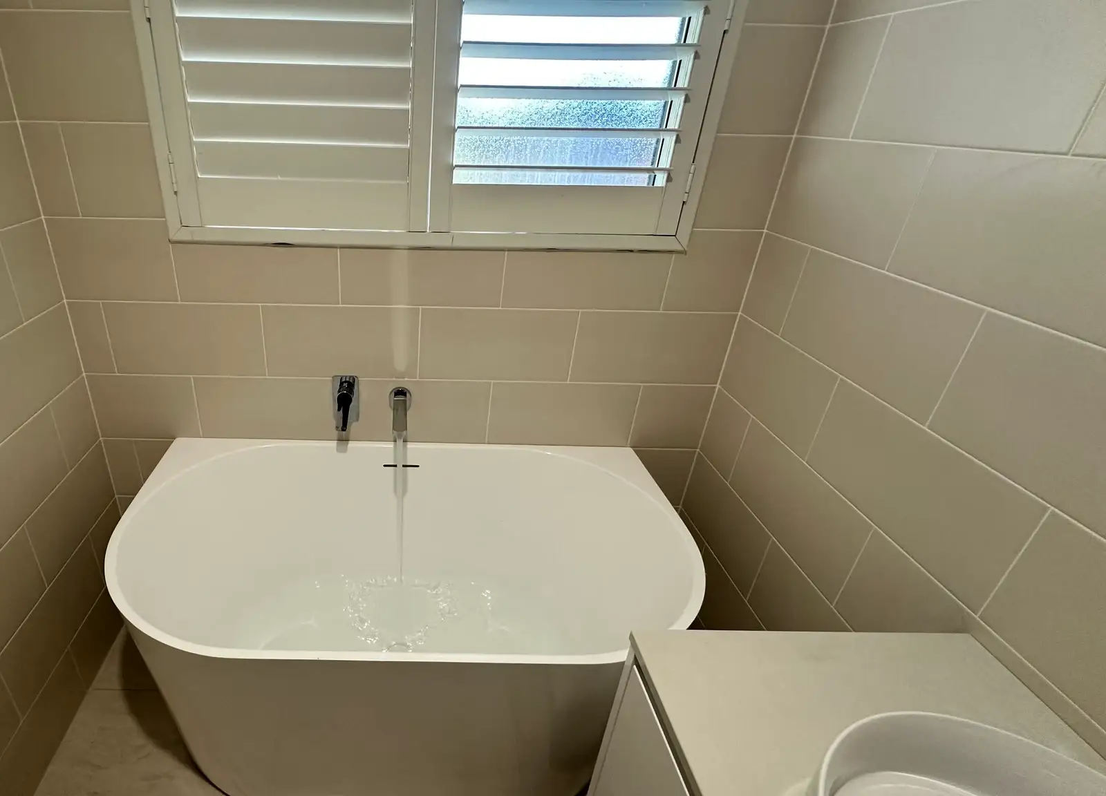 Fully stocked plumbing work van with its side door open in a Western Sydney driveway